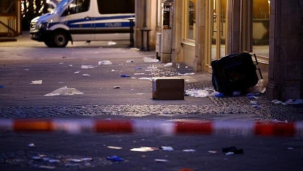 <div class="paragraphs"><p>A police vehicle stands at the site where a car drove into a crowd at a Magdeburg Christmas market in Magdeburg, Germany</p></div>