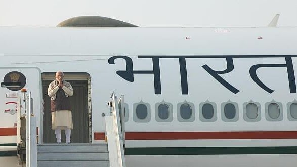 <div class="paragraphs"><p> Prime Minister Narendra Modi greets as he emplanes for Kuwait on a 2-day visit.</p></div>