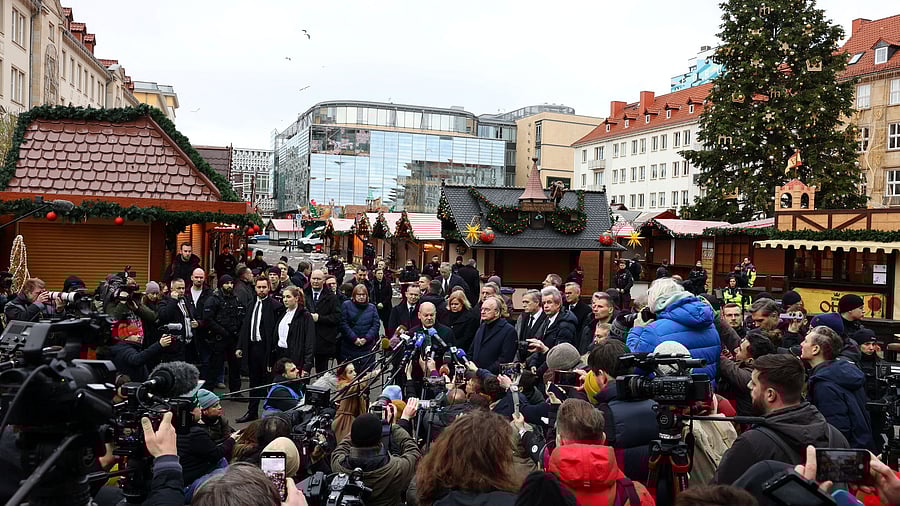 <div class="paragraphs"><p>German Chancellor Olaf Scholz, accompanied by Prime Minister of Saxony-Anhalt Reiner Haseloff, Interior Minister Nancy Faeser and Transport Minister Volker Wissing, speaks to the media during a visit to the site where a car drove into a crowd of a Christmas market in Magdeburg, Germany December 21, 2024. </p></div>