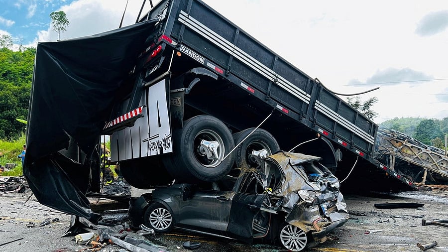 <div class="paragraphs"><p>A damaged car is crushed under a vehicle following a traffic accident after a packed bus collided with a truck, at the Fernao Dias national highway, near Teofilo Otoni, Brazil, December 21, 2024. </p></div>