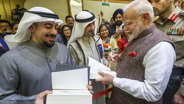<div class="paragraphs"><p>Prime Minister Narendra Modi being welcomed by members of the Indian community upon his arrival, in Kuwait, Saturday, Dec. 21, 2024. Modi on Saturday arrived in the Gulf nation on a two-day visit where he will meet the Indian diaspora and hold talks with Kuwaiti leadership to "strengthen the India-Kuwait friendship across various sectors".</p></div>