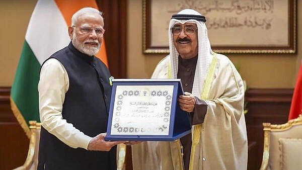 <div class="paragraphs"><p>Prime Minister Narendra Modi being conferred with Kuwait's highest honour 'The Order of Mubarak Al Kabeer' by Amir of Kuwait Sheikh Meshal Al-Ahmad Al-Jaber Al Sabah, in Kuwait, Sunday. </p></div>