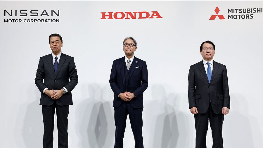 <div class="paragraphs"><p>Makoto Uchida, Director, Representative Executive Officer, President and CEO of Nissan Motor Corporation, Toshihiro Mibe, Director, President and Representative Executive Officer of Honda and Takao Kato, Director, Representative Executive Officer, President & CEO of Mitsubishi Motors, pose for a photo following a joint press conference on their merger talks, in Tokyo, Japan, December 23, 2024. </p></div>