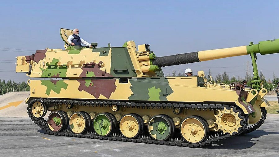 <div class="paragraphs"><p>Prime Minister Narendra Modi rides a K-9 Vajra Self-Propelled Howitzer built by Larsen & Toubro.</p></div>