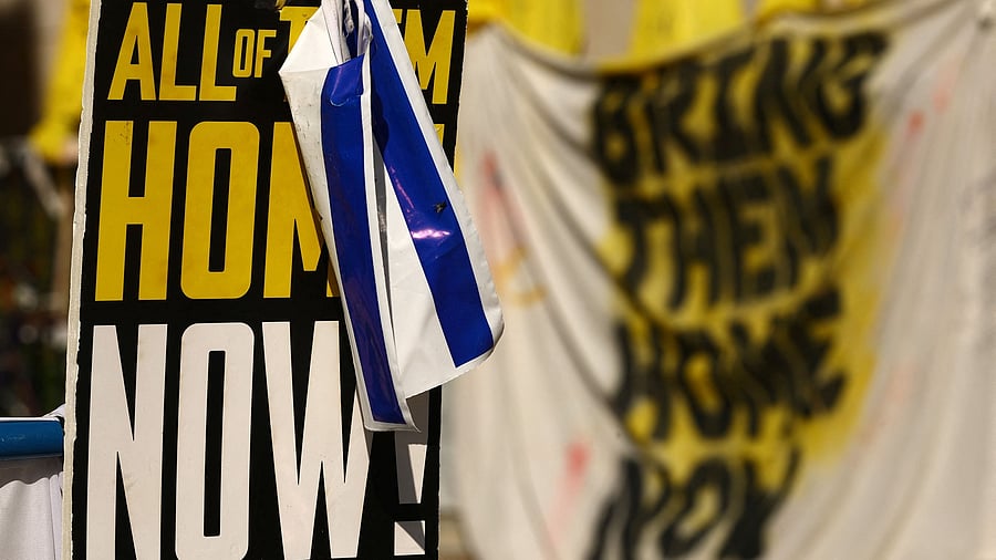 <div class="paragraphs"><p>"Bring them home" sign in support of the hostages kidnapped during the deadly October 7, 2023 attack by Hamas, hangs in Tel Aviv, Israel, December 23, 2024.  </p></div>