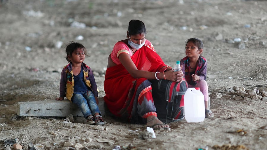 <div class="paragraphs"><p>A migrant worker sits with her children in New Delhi. Representative image. </p></div>