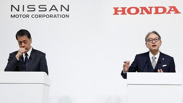 <div class="paragraphs"><p>Makoto Uchida, Director, Representative Executive Officer, President and CEO of Nissan Motor Corporation and Toshihiro Mibe, Director, President and Representative Executive Officer of Honda, attend a joint press conference on their merger talks, in Tokyo, Japan.</p></div>