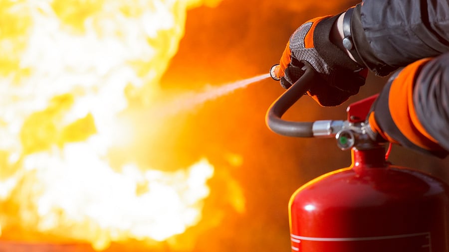 <div class="paragraphs"><p>Representative image. A fireman uses an extinguisher to douse a fire.</p></div>