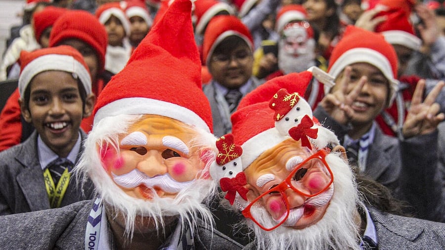 <div class="paragraphs"><p>Students wear Santa Claus masks during an event on Christmas eve, at Blue Bells Model School in Gurugram.</p></div>