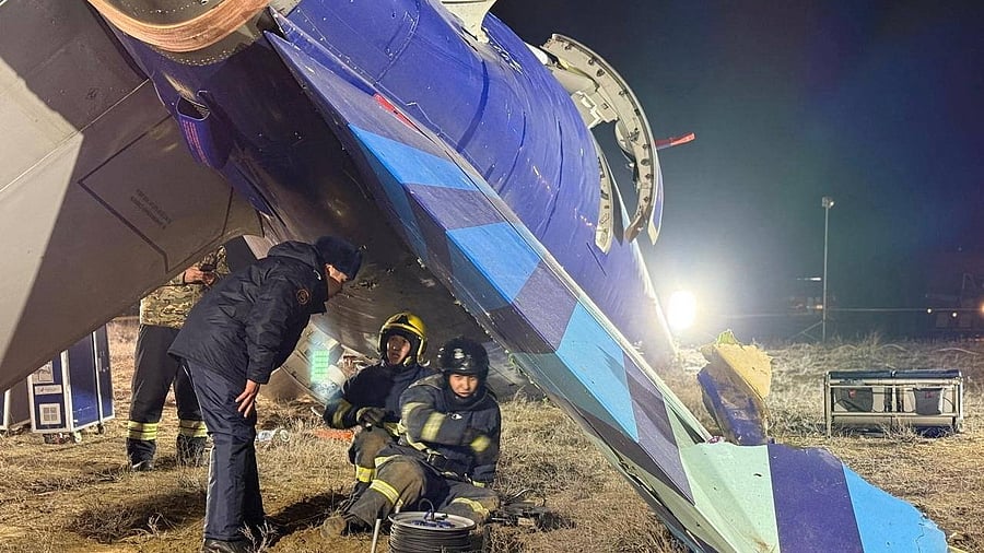 <div class="paragraphs"><p>Emergency specialists work at the crash site of an Azerbaijan Airlines' Embraer passenger plane near the city of Aktau, Kazakhstan, in this picture released December 26, 2024. </p></div>