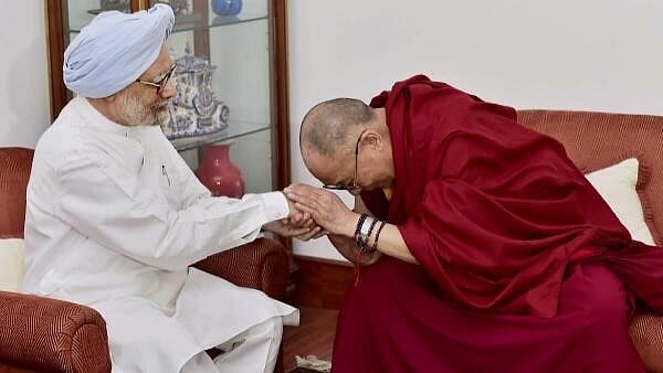 <div class="paragraphs"><p>File Photo of former Prime Minister Manmohan Singh with Tibetan Spiritual leader, the Dalai Lama, at his residence in New Delhi.</p></div>