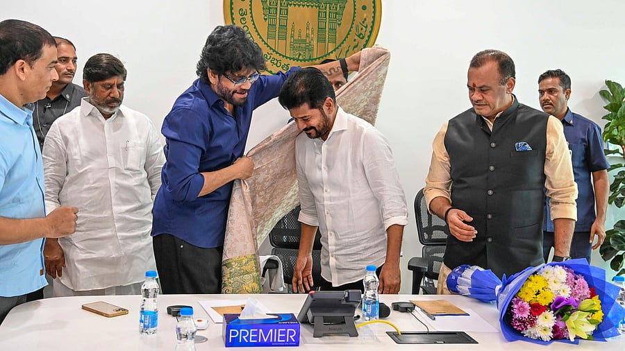 <div class="paragraphs"><p>Telangana Chief Minister A Revanth Reddy with actor Nagarjuna during a meeting with directors, producers and actors of Telugu film industry, in Hyderabad, Thursday, Dec. 26, 2024. </p></div>