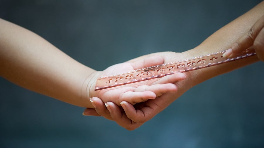 <div class="paragraphs"><p>Student being physically punished by teacher with a ruler. Representational purpose </p></div>