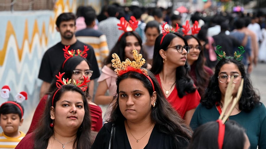 <div class="paragraphs"><p>Girls in Bengaluru don the festive garb of Santa hats, bringing joy and colour to the seasonal gatherings in the city's lively streets.</p></div>