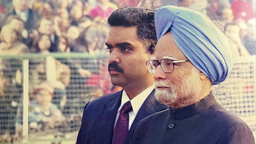 <div class="paragraphs"><p>File photo of Manmohan Singh with his former bodyguard Asim Arun.&nbsp;</p></div>