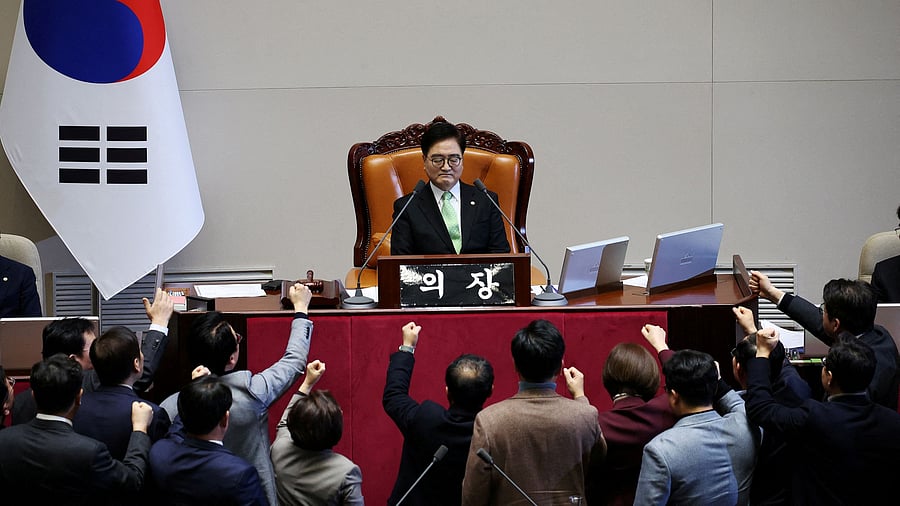 <div class="paragraphs"><p>South Korea’s ruling People Power Party lawmakers protest against National Assembly Speaker Woo Won-shik during the impeachment vote of a plenary session for South Korean acting President and Prime Minister Han Duck-soo at the National Assembly in Seoul, South Korea, December 27, 2024.   </p></div>