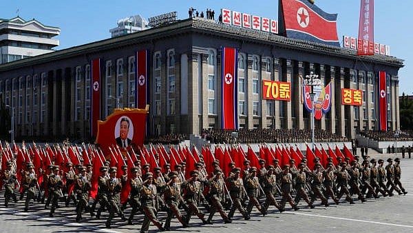 <div class="paragraphs"><p>Soldiers march with the portrait of North Korean founder Kim Il Sung during a military parade in Pyongyang. (Representative image)</p></div>