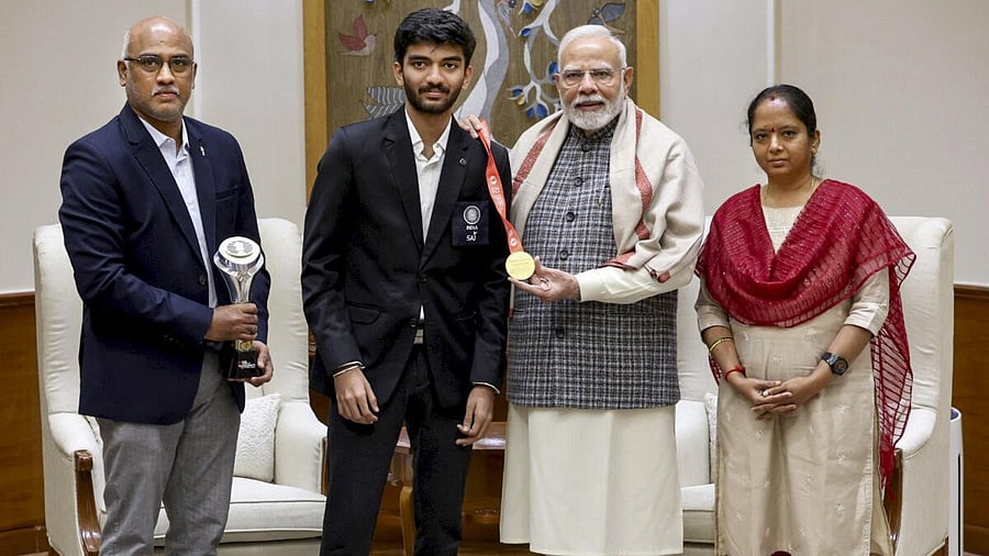<div class="paragraphs"><p>Prime Minister Narendra Modi with World Chess Champion D Gukesh and his parents during a meeting, in New Delhi.</p></div>