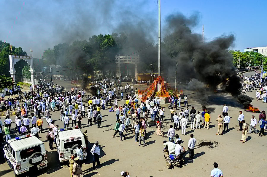 <div class="paragraphs"><p>BJP leaders stage a protest against the Congress by burning tyres, in Kalaburagi on Saturday. </p></div>