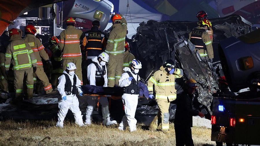 <div class="paragraphs"><p>Rescue workers carry the body of a passenger, recovered from the wreckage of an aircraft that went off the runway and crashed, at Muan International Airport, in Muan, South Korea, December 29, 2024.</p></div>
