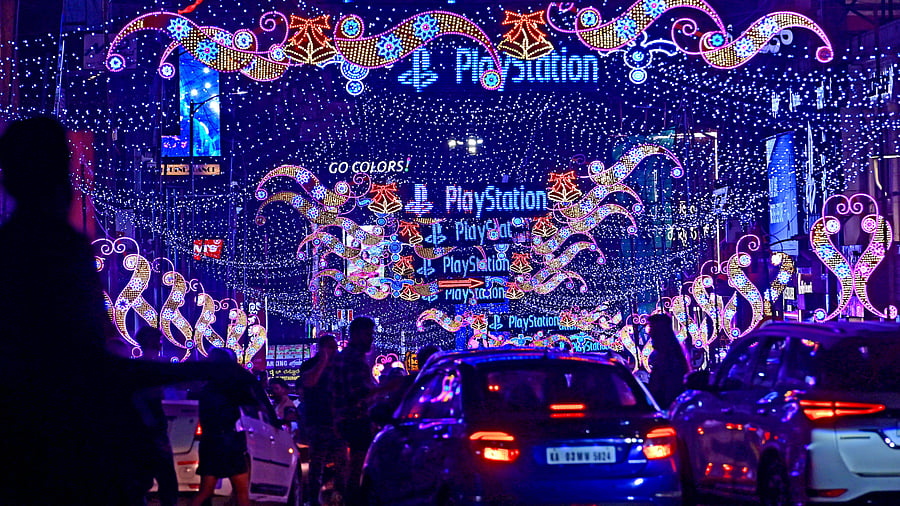 <div class="paragraphs"><p>Vehicles pass through a colourfully lit and tastefully decorated Brigade Road.</p></div>