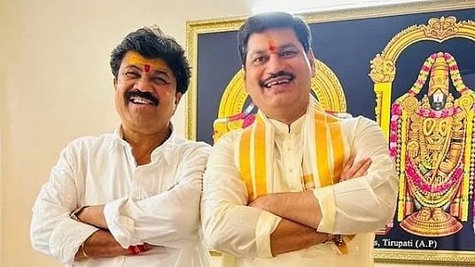 <div class="paragraphs"><p>Walmik Karad (L) with Dhananjay Munde.</p></div>