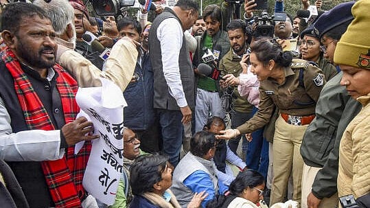 <div class="paragraphs"><p>Police personnel stop Left and Congress MLAs during their protest march towards Raj Bhavan, demanding re-examination of BPSC 70th Prelims exam, in Patna.&nbsp;</p></div>