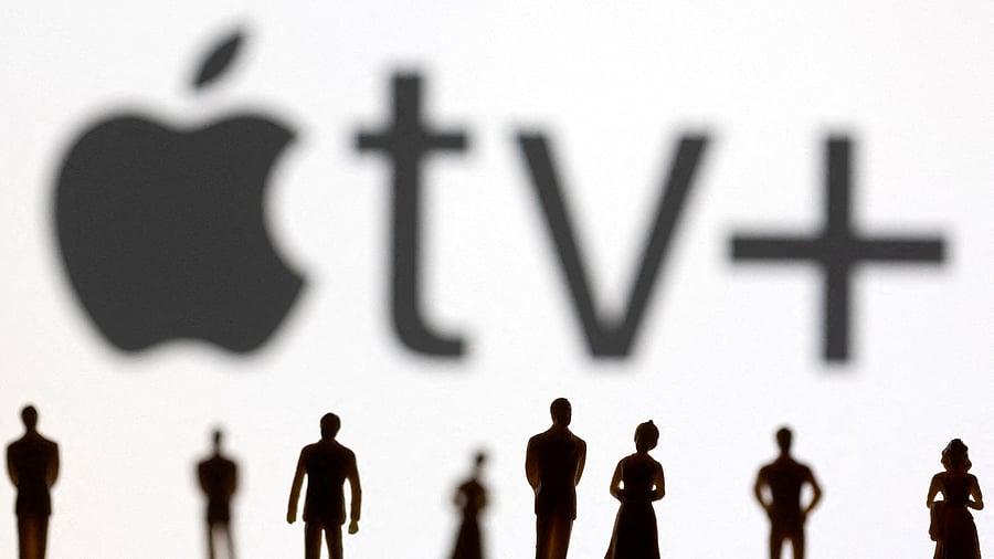 <div class="paragraphs"><p> Toy figures of people are seen in front of the displayed Apple TV + logo, in this illustration.</p></div>