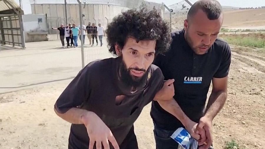 <div class="paragraphs"><p>Palestinian prisoner Moazaz Obaiyat, released from Israeli jail, walks near Hebron in the Israeli-occupied West Bank, July 8, 2024 in this screengrab obtained from video. </p></div>