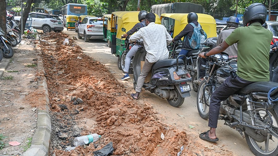 <div class="paragraphs"><p>Motorists struggle on a dug-up road at 5th block Jayanagar. </p></div>