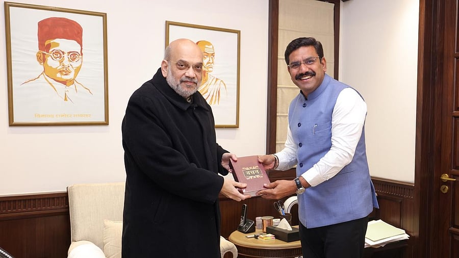 <div class="paragraphs"><p>BJP state unit chief B Y Vijayendra (right) strikes a happy pose after meeting Home Minister Amit Shah in New Delhi on Wednesday.&nbsp;</p></div>