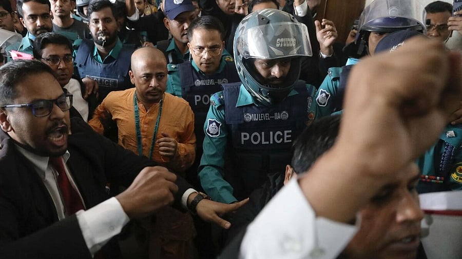 <div class="paragraphs"><p>A file image of Hindu monk Chinmoy Krishna&nbsp;Das being brought to&nbsp;magistrate court in Chattogram, Bangladesh.</p></div>