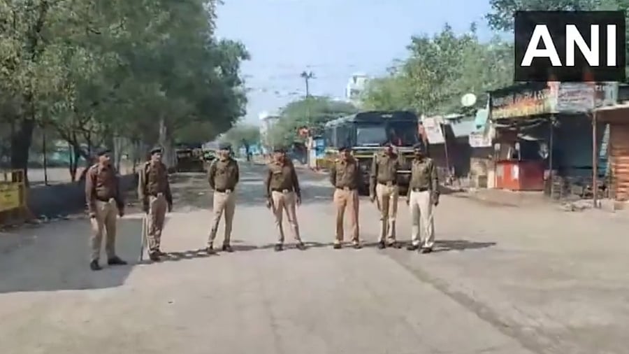 <div class="paragraphs"><p>Screengrab from the video showing police personnel&nbsp;at Palthi village in&nbsp;Maharashtra's Jalgaon after curfew was imposed there.</p></div>