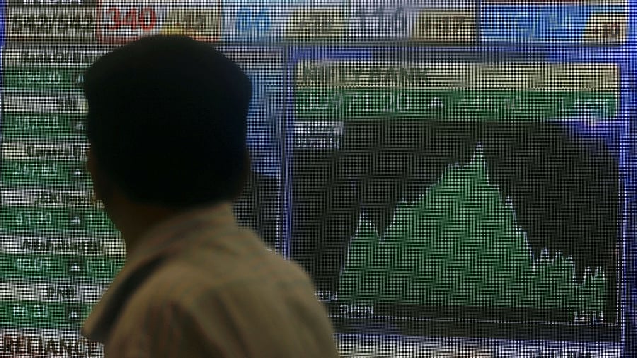 <div class="paragraphs"><p>Representative image of a person looking at a screen displaying news of markets update inside the Bombay Stock Exchange building. </p></div>