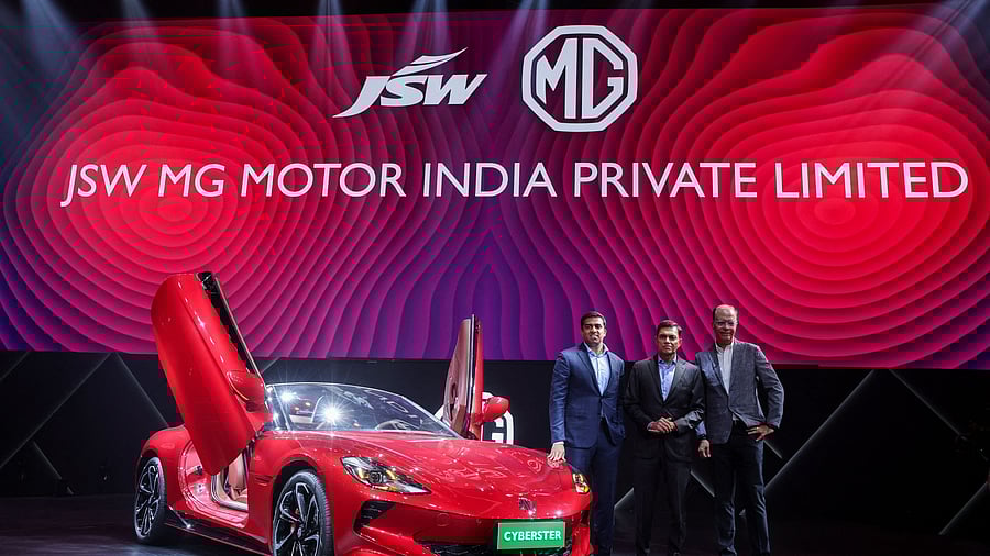 <div class="paragraphs"><p>JSW Cement Managing Director Parth Jindal, JSW Steel Managing Director Sajjan Jindal, and CEO Emeritus of MG Motor India Rajeev Chaba pose with the MG Cyberster, an electric sports car during a press conference in Mumbai, India. </p></div>