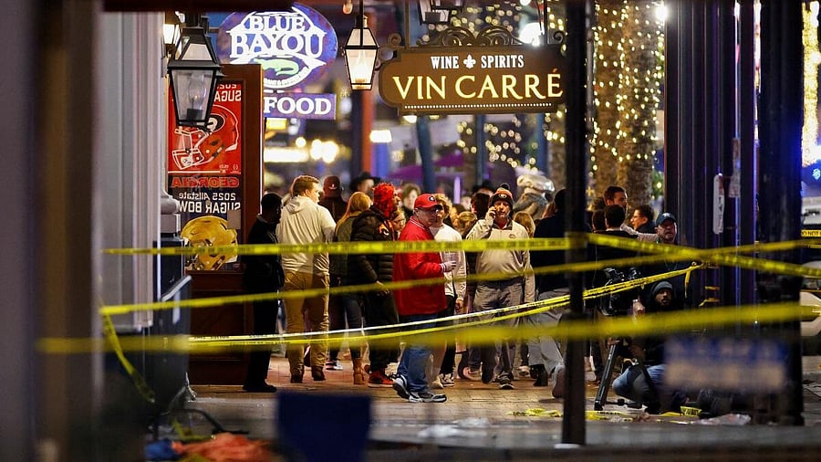 <div class="paragraphs"><p>People stand near the site where people were killed by a man driving a truck in an attack during New Year's celebrations, in New Orleans, Louisiana, US, January 1, 2025.</p></div>