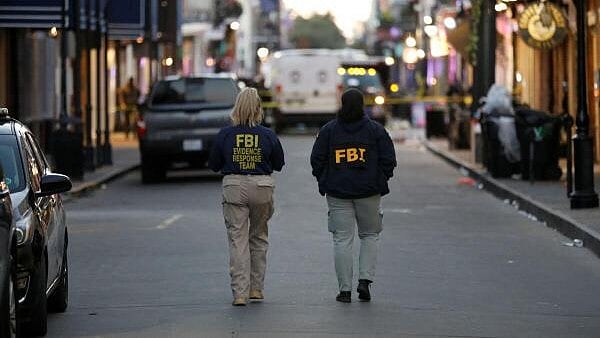 <div class="paragraphs"><p>FBI agents walk near the site where people were killed by a man driving a truck in an attack during New Year's celebrations, in New Orleans, Louisiana, US January 1, 2025.</p></div>