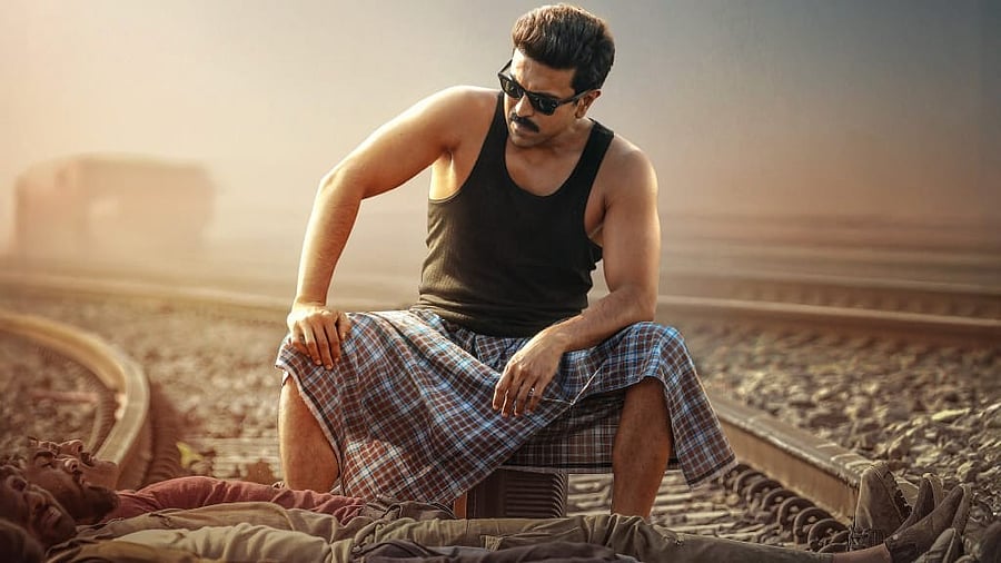 <div class="paragraphs"><p>Ram Charan on the poster of <em>Game Changer</em>.</p></div>