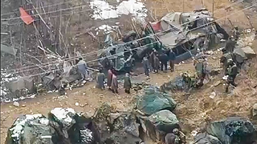 <div class="paragraphs"><p>Security personnel and people gather near an overturned army vehicle skidded off the road and fell into a gorge near SK Payen, in Bandipora district, Jammu and Kashmir.</p></div>