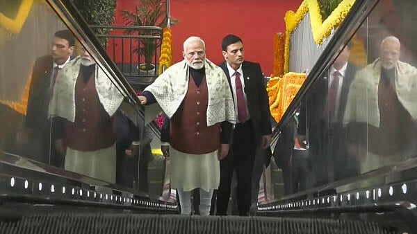 <div class="paragraphs"><p>Prime Minister Narendra Modi arrives to take a ride on the Namo Bharat train during the inauguration of the 13 km stretch of the Delhi-Ghaziabad-Meerut Namo Bharat corridor between Sahibabad and New Ashok Nagar.</p></div>