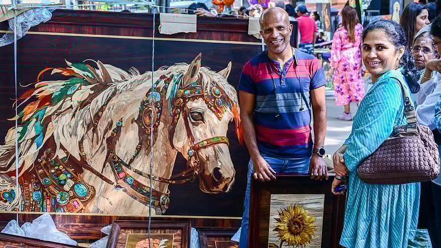 <div class="paragraphs"><p>Visitors at Bengaluru’s iconic annual art fair, Chitra Santhe, on Sunday. This year’s theme — The Girl Child — highlights the need to stand in solidarity against the abuse of women and girl children. </p></div>