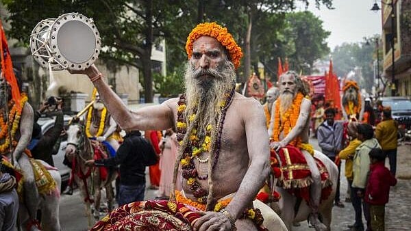 <div class="paragraphs"><p>Sadhus of the Shree Mahanirvani Akhada take part in the 'Chavni Pravesh', or royal entry procession ahead of the Mahakumbh, at Sangam in Prayagraj, Thursday. </p></div>
