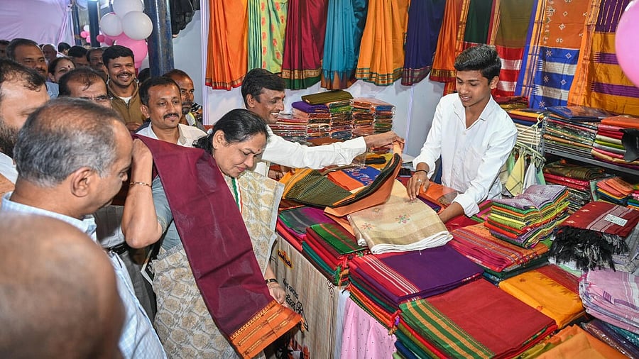 <div class="paragraphs"><p>Shobha Karandlaje, Minister of State for Micro, Small and Medium Enterprises, is captivated by a handloom saree at the South Zonal Level Exhibition at Freedom Park, Bengaluru on Saturday. </p></div>