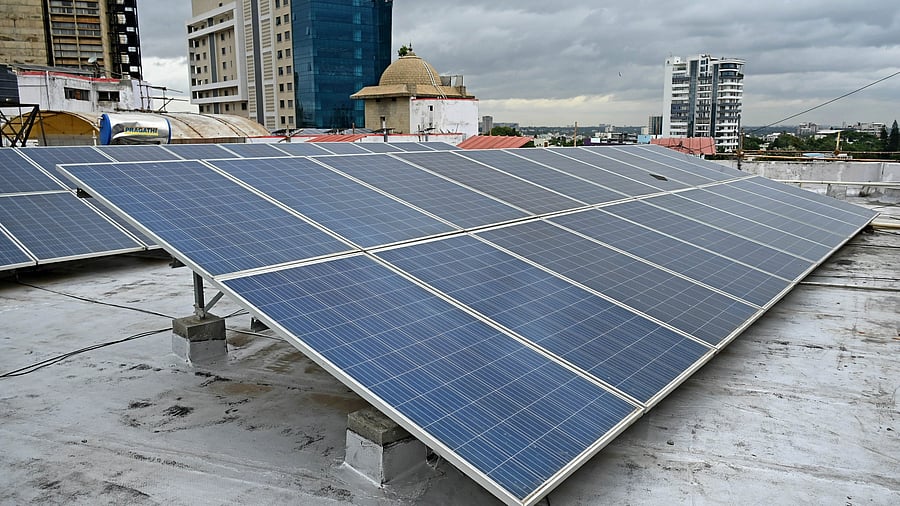 <div class="paragraphs"><p>Rooftop solar panels atop a building. </p></div>