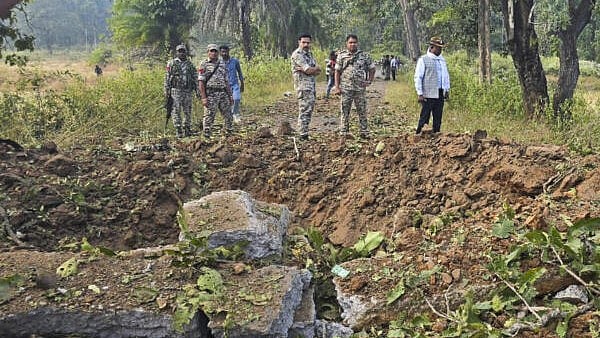 <div class="paragraphs"><p>Security personnel at the site following the death of eight jawans of District Reserve Guards (DRG) and a civilian driver after Naxals blew up their vehicle with an improvised explosive device, in Chhattisgarh's Bijapur.</p></div>