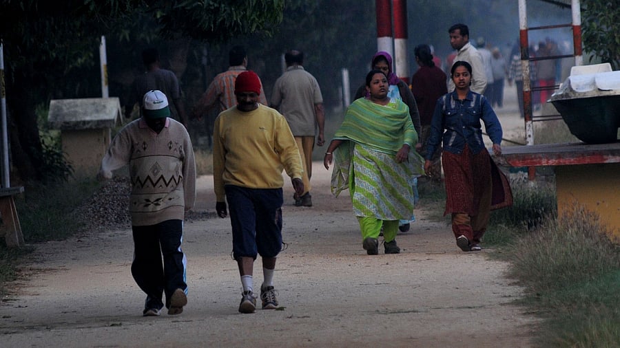 <div class="paragraphs"><p>Morning walkers wear woolen clothing and caps to beat the chill, in Mysuru.  </p></div>
