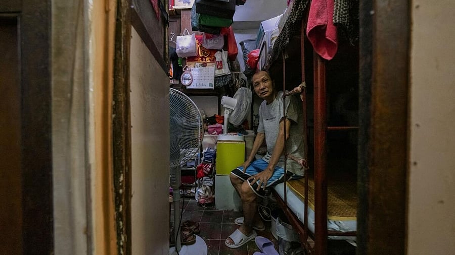 <div class="paragraphs"><p>Kwok Kwai, 65, poses for a photo inside his subdivided flat in Hong Kong, China, August 8, 2024. </p></div>