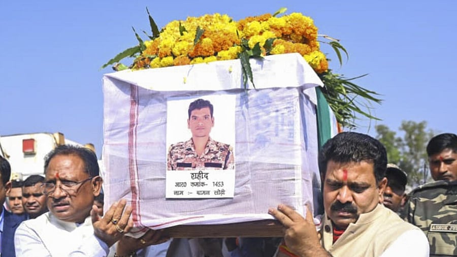 <div class="paragraphs"><p>Chhattisgarh Chief Minister Vishnu Deo Sai carries mortal remains of a security personnel who was killed in a Naxal-triggered blast on Monday in Bijapur, during a wreath-laying ceremony, in Dantewada, Tuesday, Jan. 7, 2025.</p></div>
