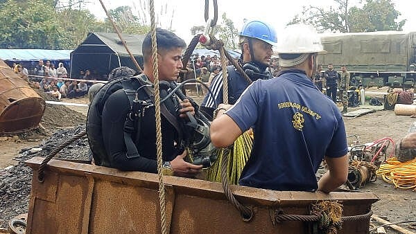 <div class="paragraphs"><p> Indian Navy personnel during the ongoing rescue operation for labourers trapped inside a coal mine at Umrangso area, in Dima Hasao district, Assam</p></div>