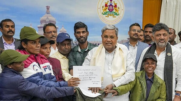<div class="paragraphs"><p>A group of Maoists surrender before Karnataka Chief Minister Siddaramaiah and Deputy CM DK Shivakumar, expressing their intention to return to the mainstream, Bengaluru, Wednesday, January 8, 2025.</p></div>